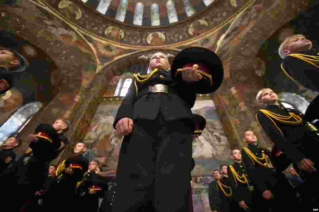 Young Ukrainian cadets attend an oath-taking ceremony and a prayer service at Kyiv Pechersk Lavra monastery in Kyiv. (EPA/Tatyana Zenkovich)