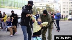 A photo of Belarusian security officers arresting a protester in Minsk that was taken by TUT.by, which was one of several online media outlets blocked by the authorities this year. 