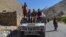 Taliban fighters sit atop a Humvee in the Omarz area of Panjshir Province in September 2021.