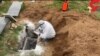 A grave dusted with quicklime for disinfection against coronavirus in Mazandaran, Iran. April 7, 2020.