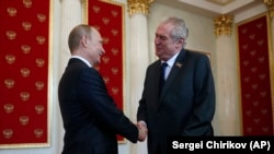 Czech President Milos Zeman (right) said last month that he asked President Vladimir Putin (left) to arrange Sputnik V deliveries to his country.