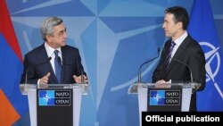 Belgium - NATO Secretary General Anders Fogh Rasmussen (R) and Armenian President Serzh Sarkisian address media after talks in Brussels, 6Mar2012.