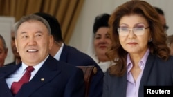 Former Kazakh President Nursultan Nazarbaev (left) and his daughter Darigha, who is now chairwoman of the country's Senate. 