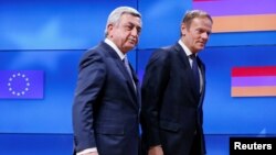 Belgium - Armenia's President Serzh Sarkisian (L) walks next to European Council President Donald Tusk after a joint news statement in Brussels, Belgium February 27, 2017