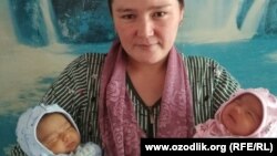 Farida Ghozieva with her newborn twin girls. She believes she also gave birth to a third child. 