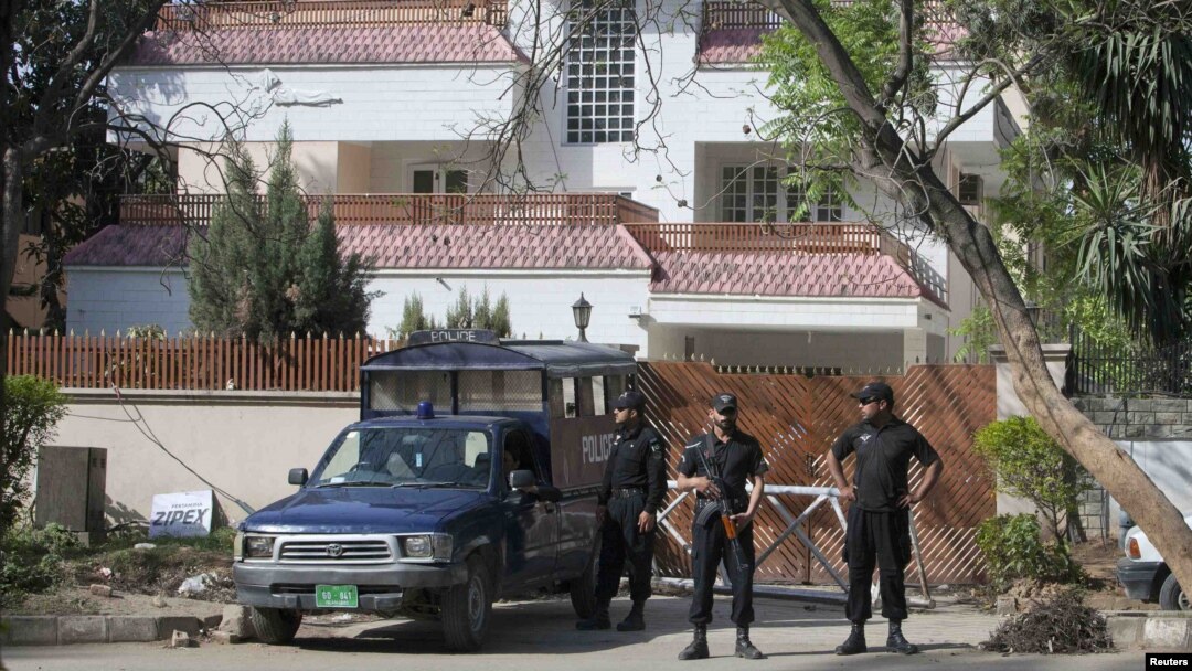 Policemen stand guard outside the house where Osama bin Laden's family is believed to have lived in Islamabad.