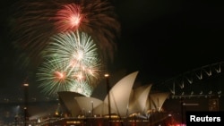 Fireworks explode over the Sydney Opera House before the midnight fireworks that ushered in the new year on December 31, 2015.