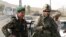 Afghanistan - An Afghan National Army (ANA) soldier (L) and a Canadian soldier with the NATO-led International Security Assistance Force (ISAF) at a checkpoint of Arghandab district in Kandahar, 17Jun2008