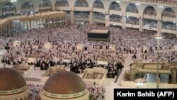 Muslim pilgrims pray at the Grand Mosque in the holy Saudi city of Mecca on the eve of the annual Hajj pilgrimage on August 29.