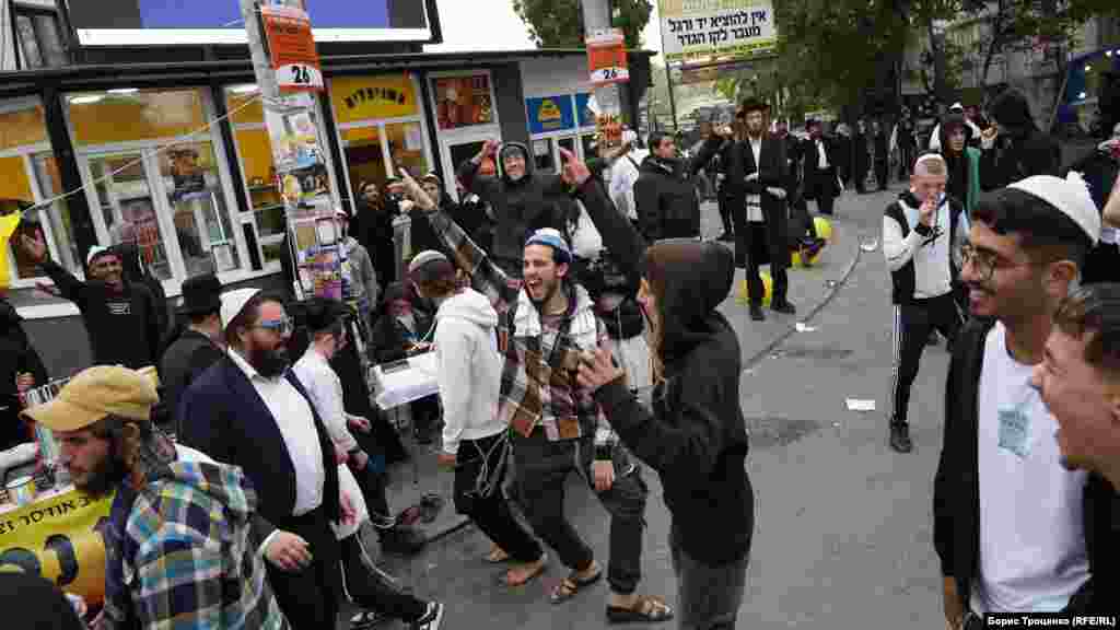 Hasidic Jewish pilgrims dance on the streets in the Ukrainian city of Uman as part of festivities celebrating Rosh Hashanah, the Jewish New Year.&nbsp;