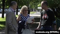 Political activist Vasil Parfyankou (right) outside the courtroom in Minsk on May 29, when he was ordered back to jail.