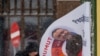 A man walks past election campaign posters in Greenland's capital, Nuuk, on March 8. 