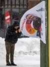 A man walks past election campaign posters in Greenland's capital, Nuuk, on March 8. 