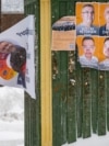 A man walks past election campaign posters in Greenland's capital, Nuuk, on March 8. 