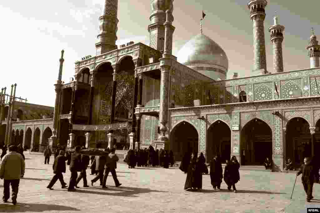 Mourners carry a coffin to the Shrine of Masume for a final pilgrimage. - One of the holiest sites in Qom is the Shrine of Masume, the sister of the Eighth Imam Reza, who died in the early 9th century. 