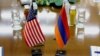 Armenia - U.S. and Armenian national flags placed on a negotiating table in Yerevan, 18Dec2013.