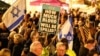 Israeli left-wing activists demonstrate on HaBima Square against the ongoing war with Iran and against the Israeli government, in Tel Aviv on May 2.