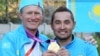 Kazakh cyclist Aleksandr Vinokurov's (left, with teammate Assan Bazaev) triumph on July 28 in the road cycling event set the tone for his country's success, one journalist says.