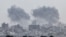 Smoke rises from Gaza after explosions, as seen from Israel