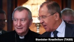 Russian Foreign Minister Sergei Lavrov (right) meets with Vatican Secretary of State Cardinal Pietro Parolin in Moscow on August 22.