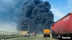 Black smoke rises near the source of an explosion near the southern Iranian port city of Bandar Abbas on April 26.