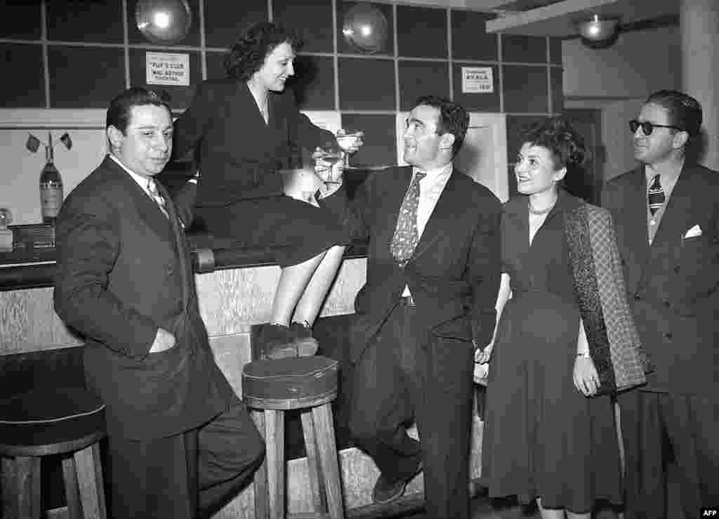 Piaf and French boxer Marcel Cerdan, the man who became the love of her life, in the Club des Cinq theater in Paris on March 17, 1948.