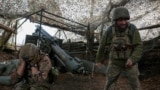 Ukrainian troops fire a self-propelled howitzer toward Russian troops near Pokrovsk earlier this month.