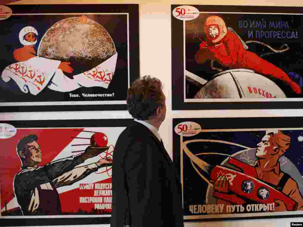 A visitor looks at an exhibit during the opening of an exhibition of Soviet space placards at the Museum of Modern Art in the Russian city of Krasnoyarsk on April 12, as &nbsp;Russia celebrated the 50th anniversary&nbsp; of Yury Gagarin's historic first space flight. Photo by Ilya Naymushin for Reuters