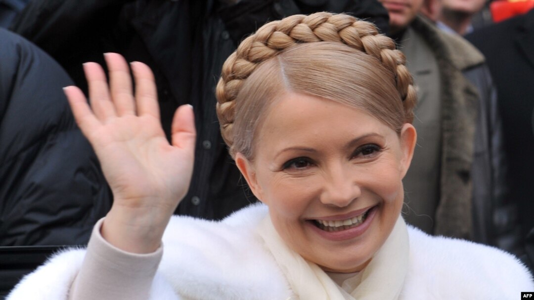 Ukraine's prime minister and presidential candidate Yulia Tymoshenko smiles as she greets people after casting her vote in her hometown of Dnipropetrovsk.