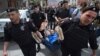 Russian riot police detain an LGBT rights activist during a rally in central Moscow in 2015.