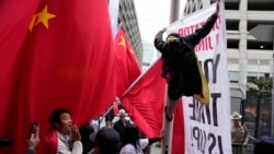 Supporters and critics of Chinese President Xi Jinping converge near the site of the 2023 APEC Summit in San Francisco. 