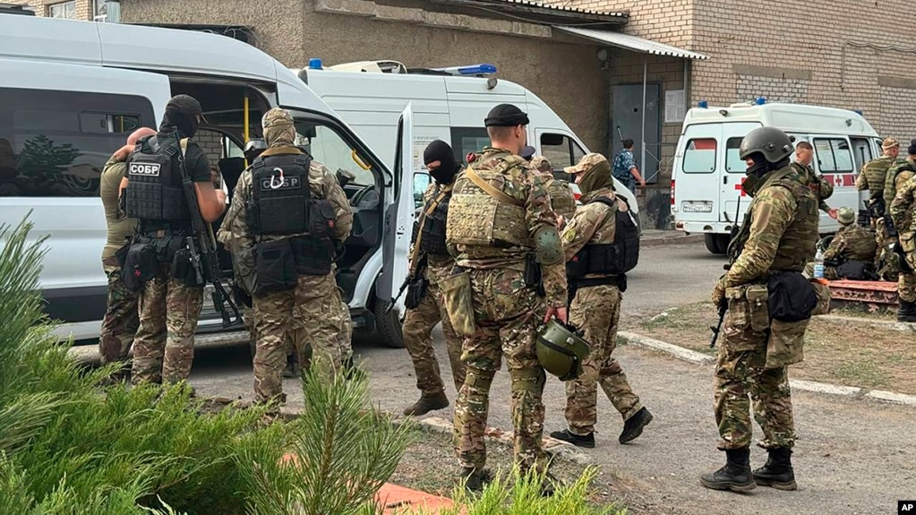 This photo released by the Russian National Guard shows soldiers standing near correctional colony No. 19 in the town of Surovikino in the Volgograd region on August 23.