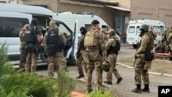 This photo released by the Russian National Guard shows soldiers standing near correctional colony No. 19 in the town of Surovikino in the Volgograd region on August 23.