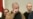 Vital Bandaruk (center) and Larisa Shchyrakova (left) weep as a choir sings a Belarusian folk song at a news conference in Vilnius on September 12, where they and other newly freed prisoners recounted repression and torture behind bars.