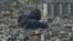 Smoke rises from the site of an Israeli strike in southern Beirut on March 28, 2025.
