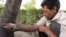Iran – A man injects drug (addict) in a Tehran park, 16Jun2010