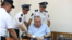 Armenia -- Police officers help General Manvel Grigorian during his trial in Yerevan.
