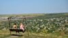 Moldova - checkinmoldova - two women in a swing, Nistru (Dniester) river, Tipova village, Rezina district