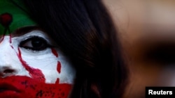 A woman takes part in a rally in support of nationwide protests in Iran, in Rome, Italy, on January 16.