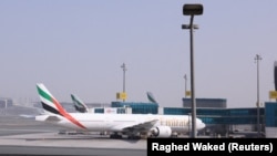 United Arab Emirates - Planes are parked at Terminal 3 of the Dubai International Airport, following the United States and Israel strikes on Iran, March 2, 2026. 