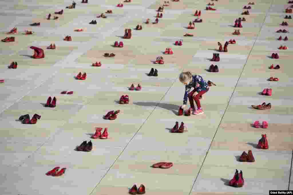 Hundreds of red shoes are displayed as a protest against violence toward women in Israel at Habima Square in Tel Aviv on December 4.&nbsp;(AP/Oded Balilty)&nbsp;