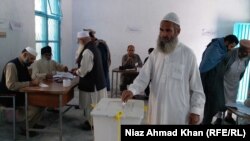 A Pakistan voter casts his ballot on October 14.