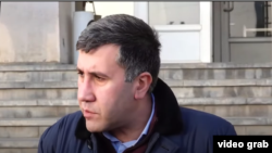 Armenia- Lawyer Ruben Melikian talks to journalists.
