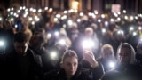 <div>
<div>
<div>
<div>Demonstrators flash mobile phone lights during a protest against government policies, corruption, and negligence, which they blame for the deaths of the victims in the November 2024 Novi Sad railway station disaster, in Belgrade on January 24.</div>
</div>
</div>
</div>
<div>&nbsp;</div>
