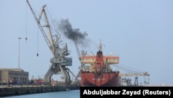 A ship unloads a cargo of fuel at the Red Sea port of Hudaydah.