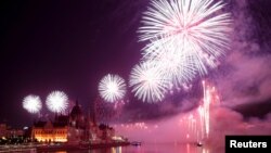 Fireworks explode over the Danube in Budapest on August 27.