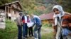 Bosnia-Herzegovina, which is still governed under a structure set out by the Dayton accords, managed to conduct a census in 2013. Here, Bosnian Muslims speak with an enumerator in the village of Krusev Do, near Srebrenica. (file photo)