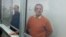 Mikhail Tkachyov (left) and Uali Aliasqarov in court in Qaraghandy on January 15