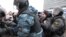 A protester is hauled off by Russian Interior Ministry troops near the Ostankino TV tower on March 18.