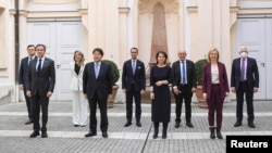 Ukrainian Foreign Minister Dmytro Kuleba (first from left, in the back row) and other diplomats at the 2022 Munich Security Conference